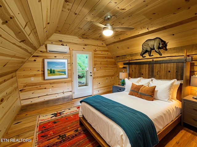 bedroom with hardwood / wood-style flooring, a wall unit AC, wooden ceiling, and wood walls