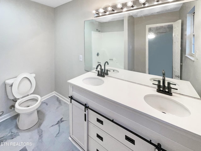 bathroom featuring vanity and toilet