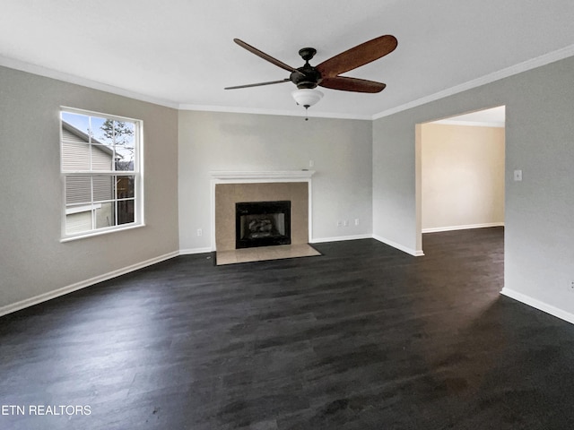 unfurnished living room featuring crown molding, dark wood-type flooring, and ceiling fan