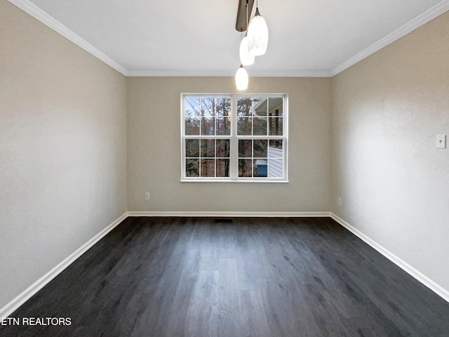 empty room with crown molding and dark hardwood / wood-style floors