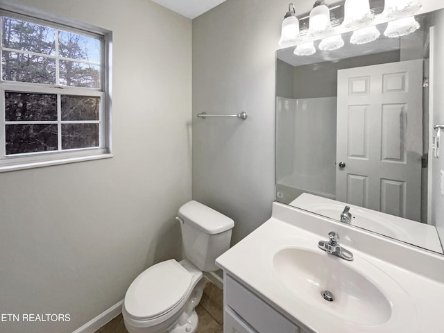 bathroom featuring vanity and toilet