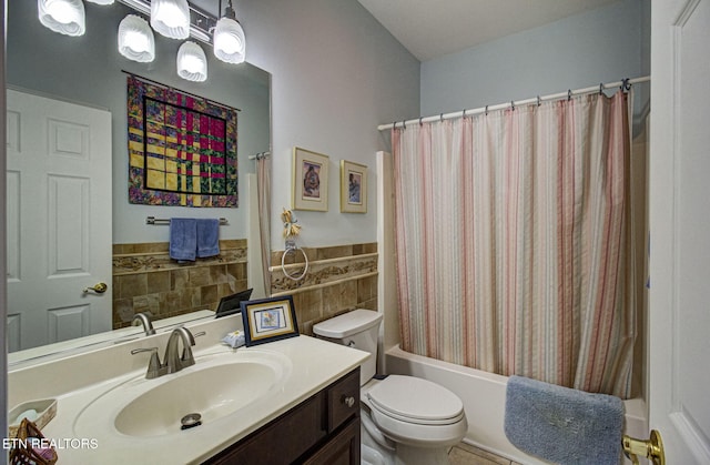 full bathroom with vanity, shower / bath combo, tile walls, and toilet