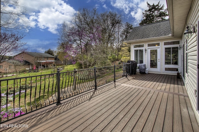 deck with a yard and grilling area