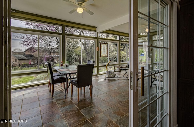 sunroom / solarium with ceiling fan and plenty of natural light