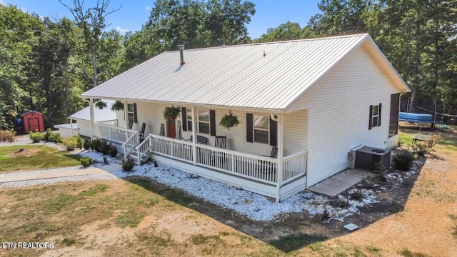 view of front facade featuring central AC unit and covered porch