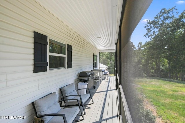 wooden deck with grilling area