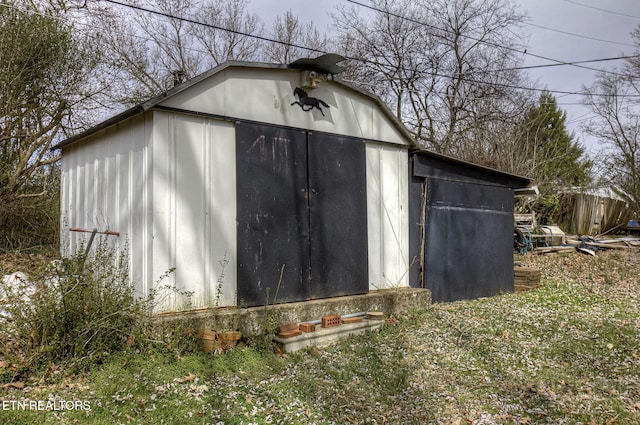 view of shed with fence