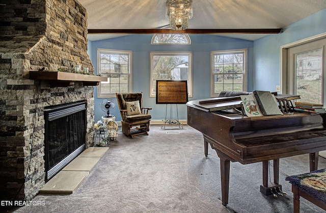 living area with a fireplace, lofted ceiling, carpet, and a healthy amount of sunlight