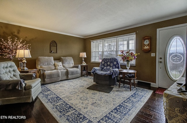 living area featuring hardwood / wood-style floors, crown molding, baseboards, and a textured ceiling