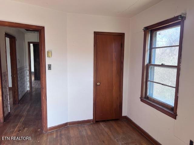 spare room featuring dark hardwood / wood-style floors