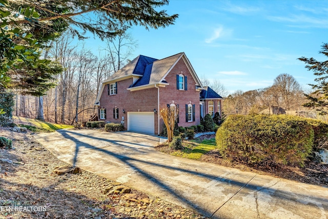 view of side of property with a garage