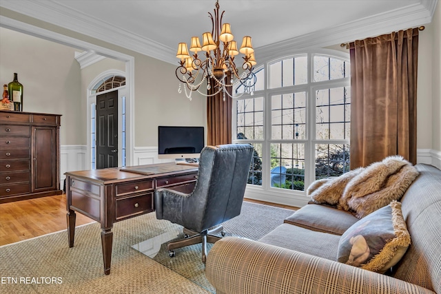 home office featuring an inviting chandelier, ornamental molding, and light hardwood / wood-style floors