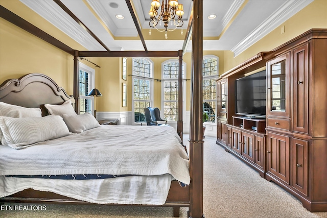 bedroom featuring a raised ceiling, crown molding, and carpet flooring