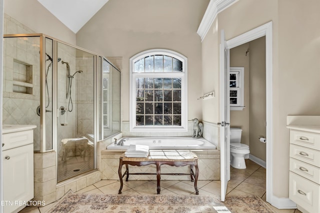 full bathroom featuring lofted ceiling, toilet, separate shower and tub, vanity, and tile patterned flooring