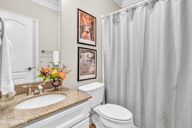 bathroom featuring vanity, ornamental molding, walk in shower, and toilet