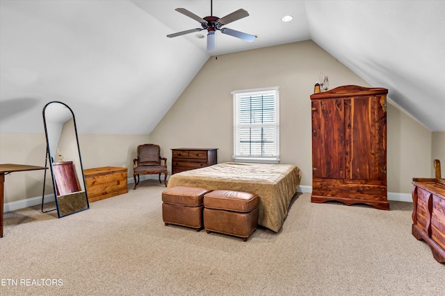 bedroom featuring light carpet, vaulted ceiling, and ceiling fan