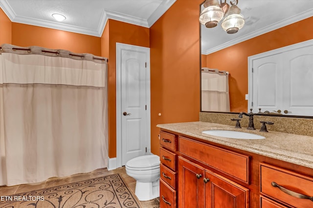 bathroom with walk in shower, tile patterned floors, toilet, crown molding, and vanity