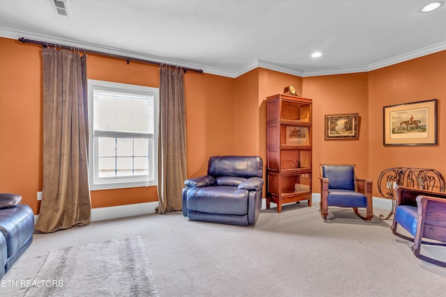 living area featuring crown molding and carpet flooring