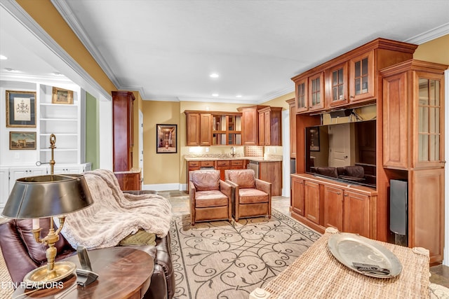 living room with ornamental molding and sink