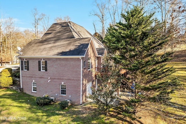 view of property exterior with a garage and a yard