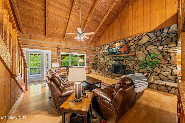 living room with light hardwood / wood-style flooring, a fireplace, wooden ceiling, and beamed ceiling