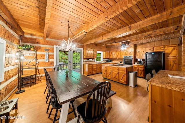 dining space with beamed ceiling, a notable chandelier, wooden ceiling, and light hardwood / wood-style floors