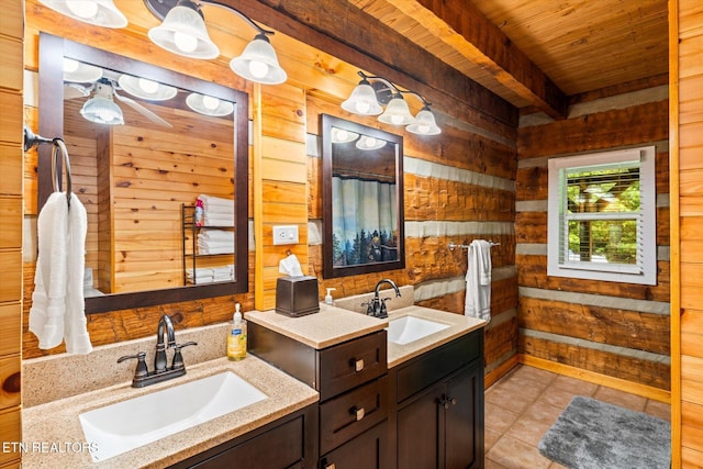 bathroom featuring wood walls, wooden ceiling, vanity, tile patterned floors, and beam ceiling