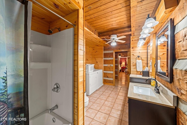 full bathroom featuring washing machine and clothes dryer, tile patterned floors, wooden ceiling, shower / washtub combination, and wooden walls