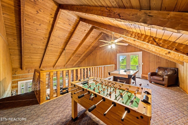 playroom with carpet floors, vaulted ceiling with beams, wooden walls, and wooden ceiling