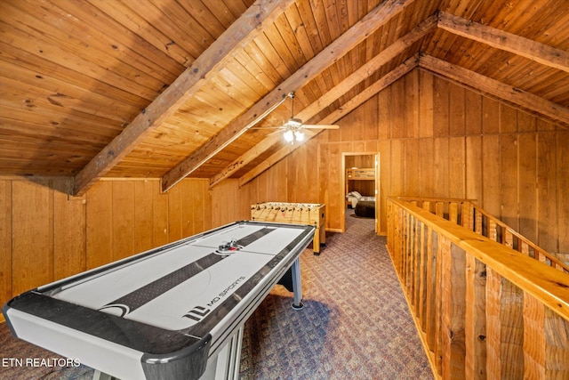 game room with wood ceiling, vaulted ceiling with beams, dark carpet, and wood walls