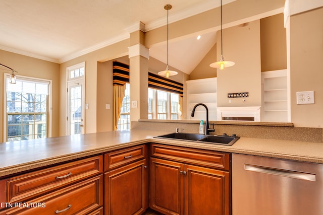 kitchen featuring a healthy amount of sunlight, sink, hanging light fixtures, and dishwasher