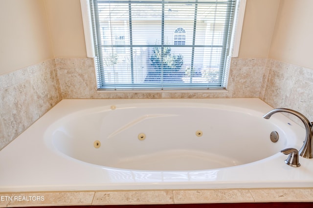 bathroom featuring tiled bath