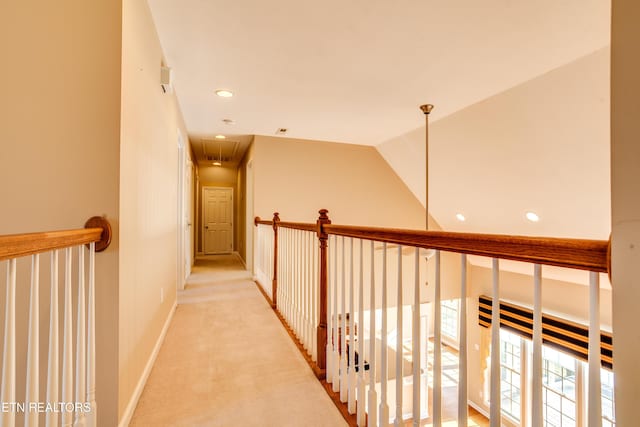 corridor with light colored carpet