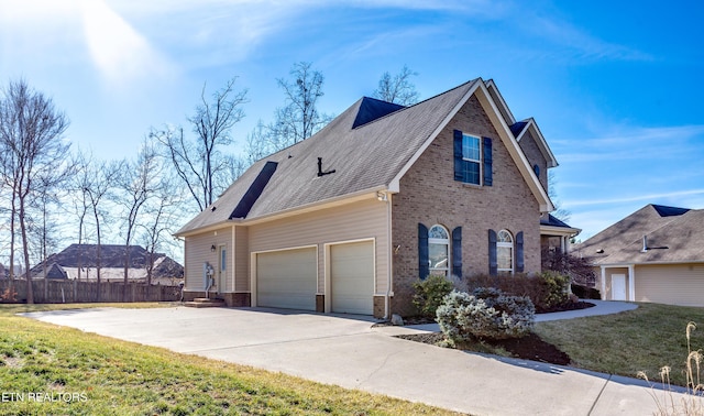 view of home's exterior featuring a garage and a lawn