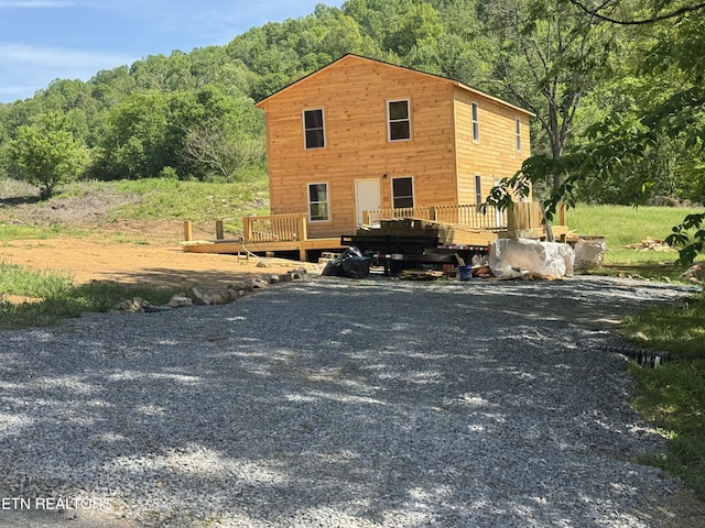 157 Greasy Cove Rd, Cosby, TN 37722 - view of front facade with a deck and a wooded view