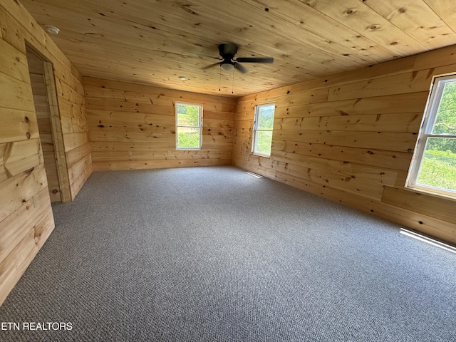 157 Greasy Cove Rd, Cosby, TN 37722 - carpeted spare room featuring wooden walls, wood ceiling, and ceiling fan