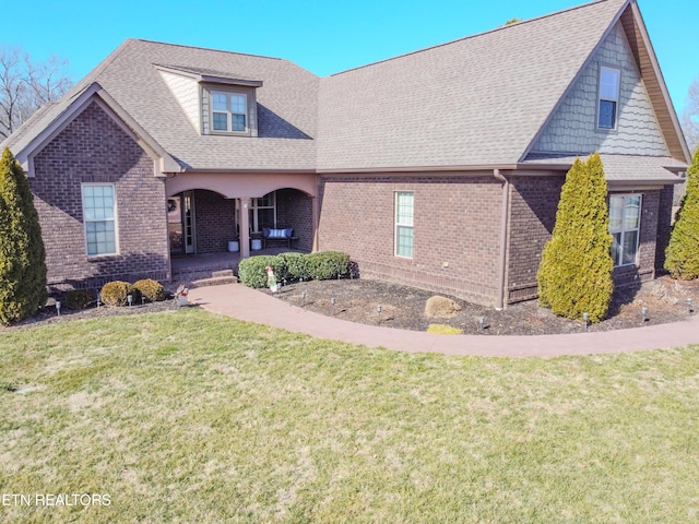 view of front facade with a porch and a front yard