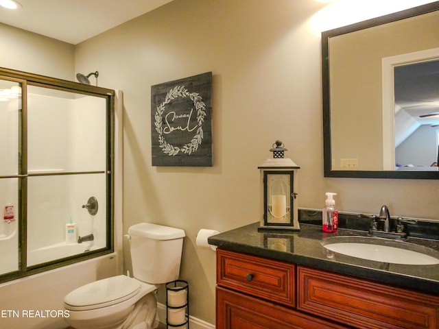 full bathroom with vanity, toilet, and combined bath / shower with glass door