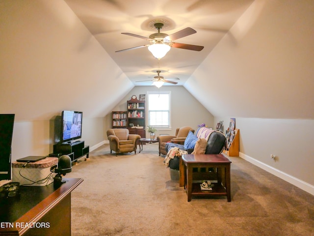 sitting room with carpet floors, ceiling fan, and vaulted ceiling