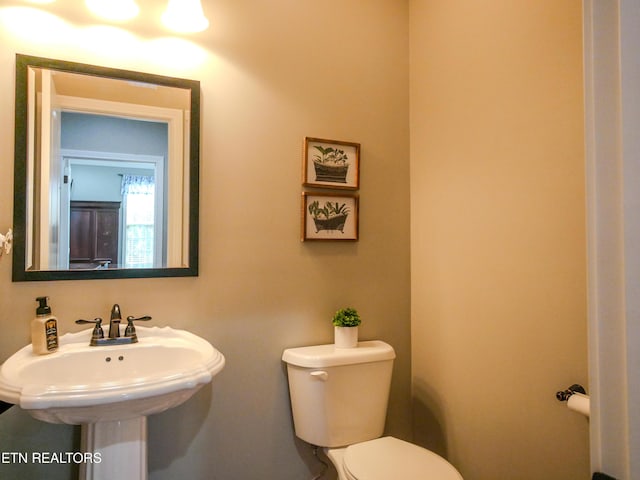 bathroom with sink and toilet