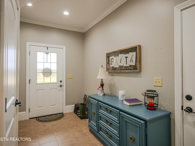 doorway featuring light tile patterned floors and ornamental molding