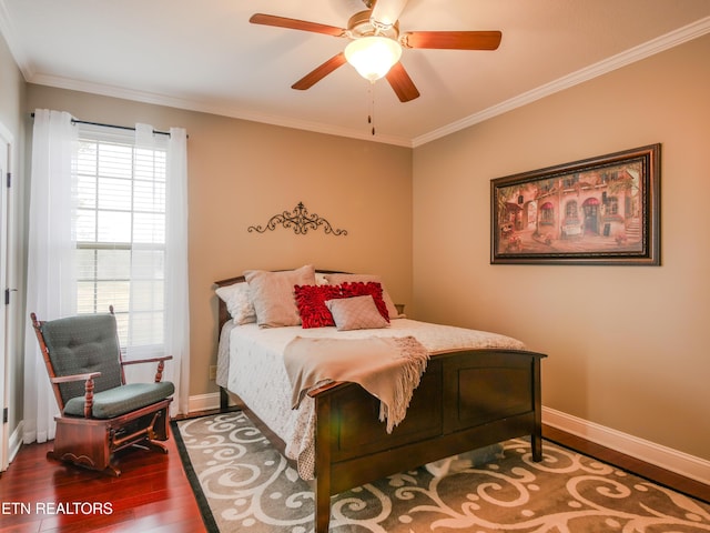 bedroom featuring wood-type flooring, ornamental molding, and ceiling fan