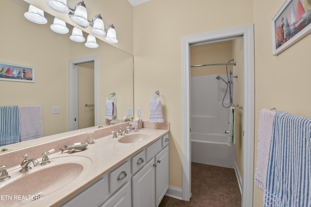 bathroom featuring tile patterned flooring, vanity, and bathtub / shower combination