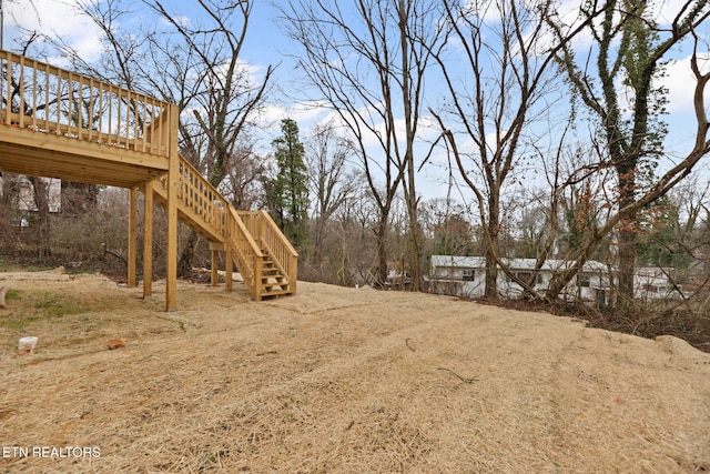 view of yard with a wooden deck