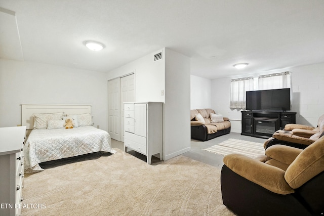 carpeted bedroom with a closet