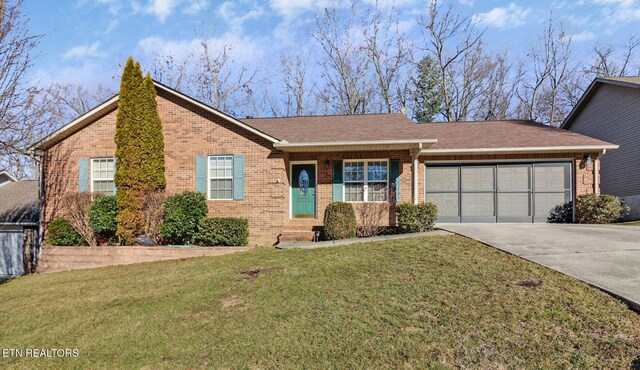 single story home with a garage and a front lawn