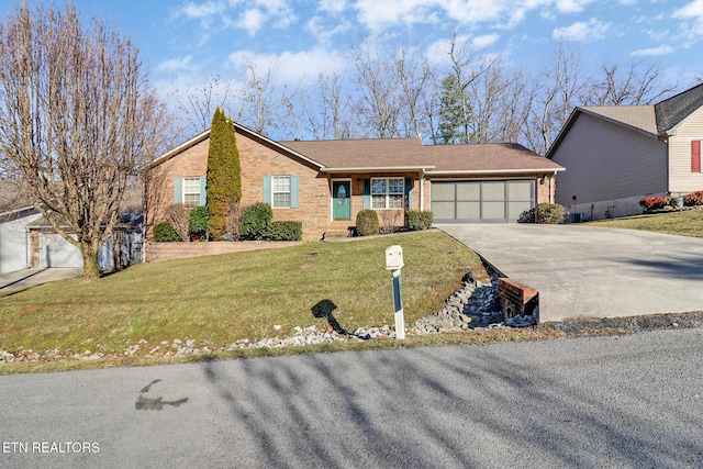 ranch-style house featuring a garage and a front yard