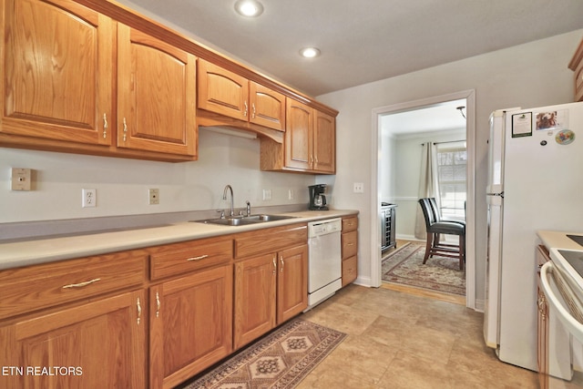 kitchen with sink and white appliances