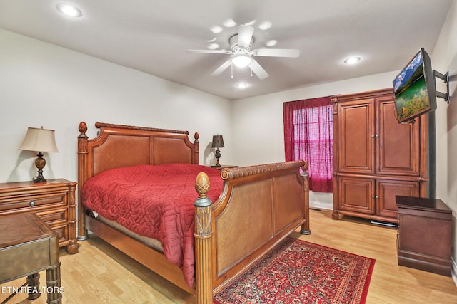 bedroom featuring ceiling fan and light hardwood / wood-style floors