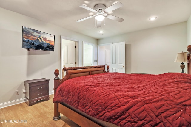 bedroom featuring ceiling fan and light hardwood / wood-style flooring